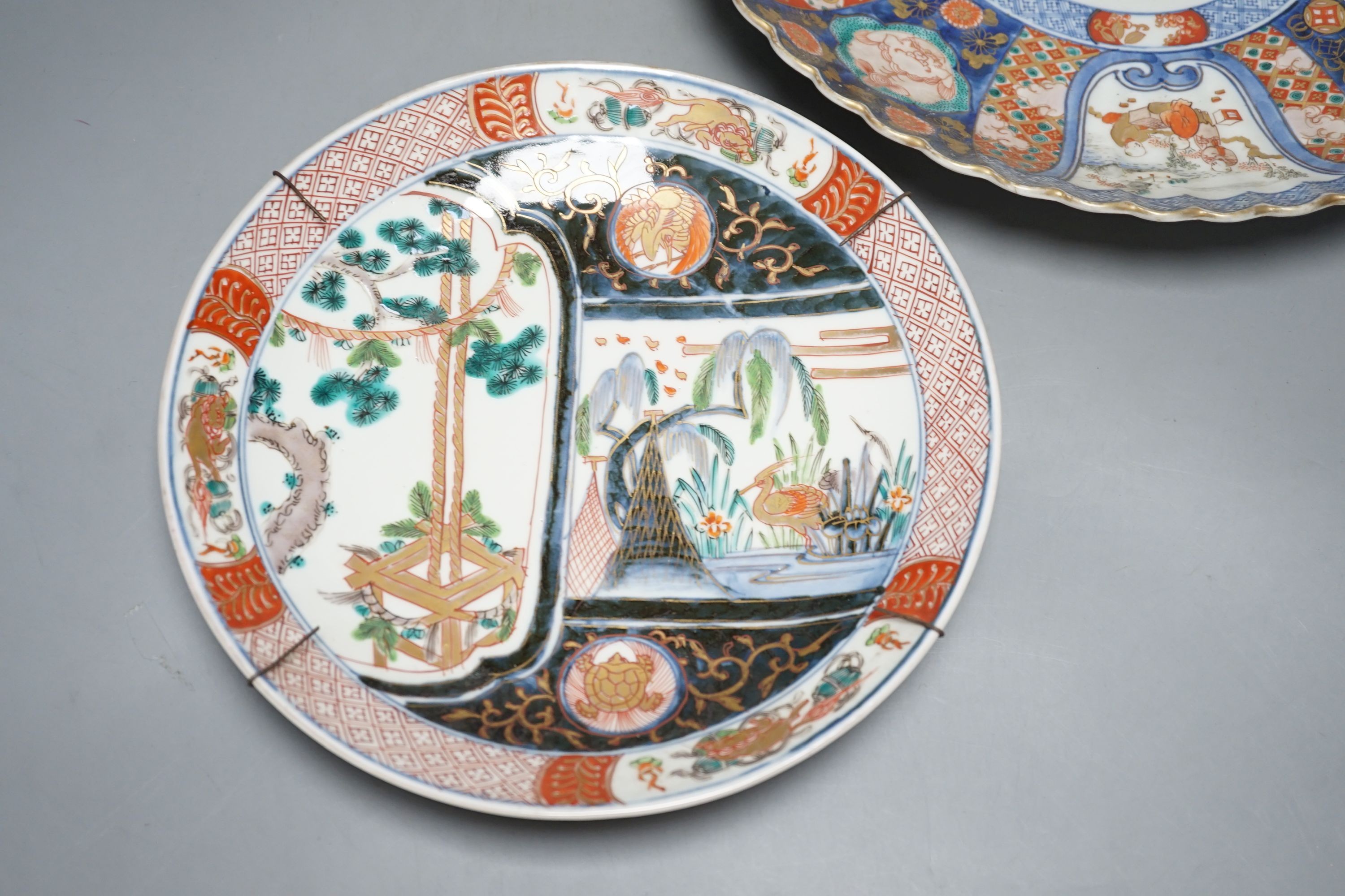 Two Japanese Imari wall plates, Meiji period - largest 35cm diameter